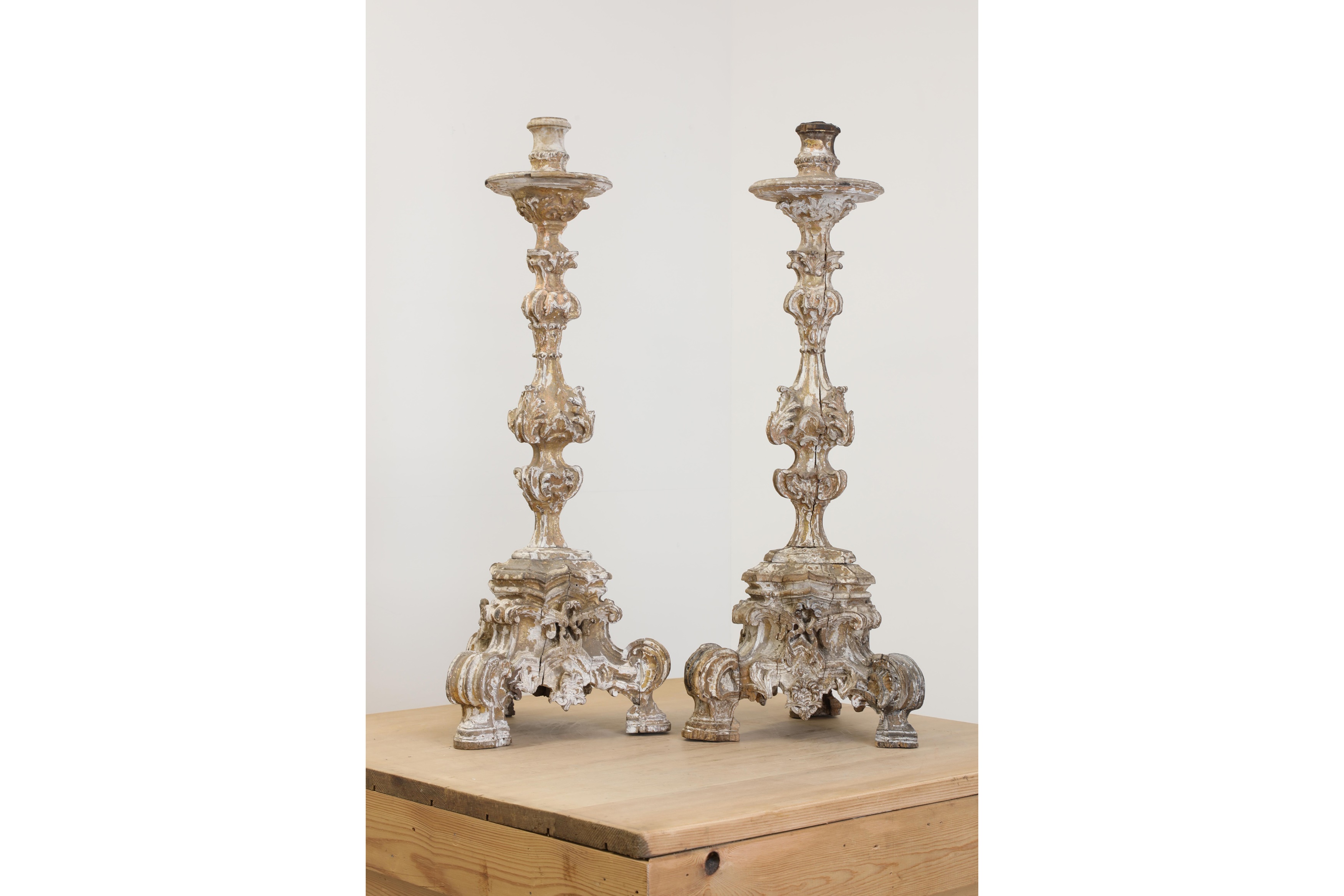 A pair of baroque carved giltwood candlestands